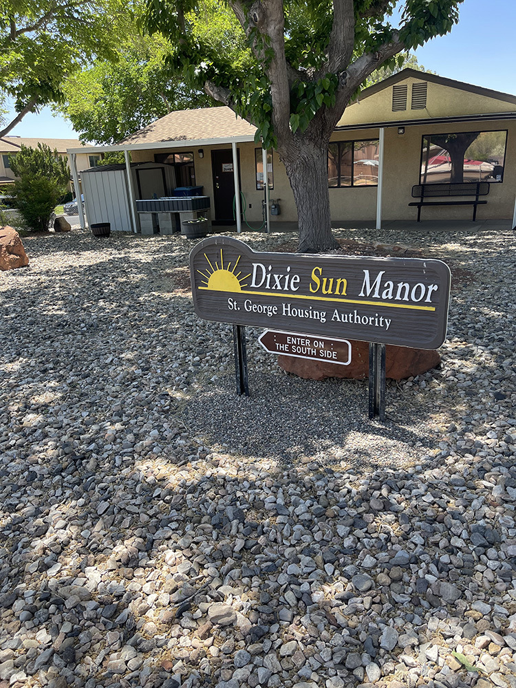 photo of St. George Housing Authority building and sign that says "Dixie Sun Manor"