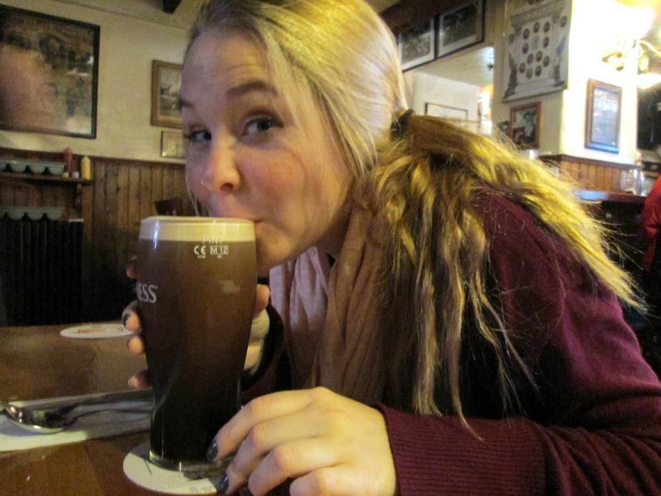 Maisy drinking a Guinness at the factory in Dublin