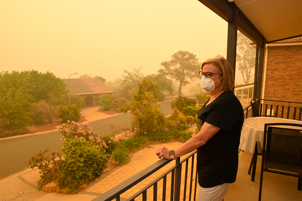 Woman wears mask to protect against smoke